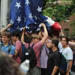 image for UNC Chapel Hill students surround the American flag to protect it from being removed.