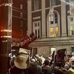 image for Police use a siege ladder to breach Columbia from the 2nd floor