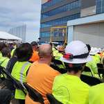 image for Fall harness safety but make it look like a hanging. From a job site meeting