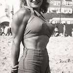 image for Abbye Stockton shows off her shoulders on Muscle Beach California, around the mid 1940s.