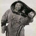image for Inuit mother protecting her baby from extreme cold.