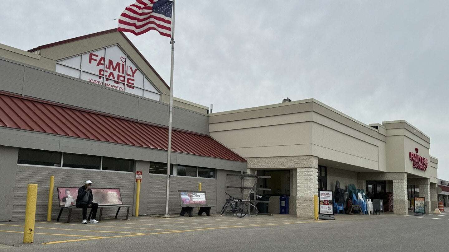image for Woman was living inside rooftop grocery store sign with computer and coffee maker for a year