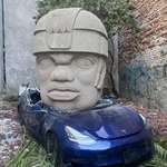 image for Tesla Crushed by an Olmec Head by Chavis Mármol
