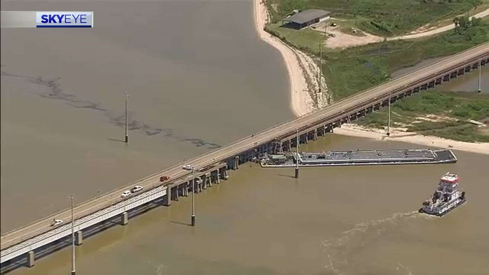 image for Pelican Island bridge reopens for evacuation-only after barge slams into span, causing oil spill