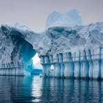 image for Ice Formations In Antarctica That Look Like Ice Walls, Columns, And An Archway