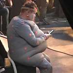 image for James Corden on his phone on the set of Cats