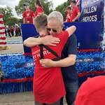 image for Gary Sinise giving out hugs at the Memorial Day Parade in Washington, D.C.