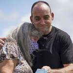 image for Locked away at 18, Robert DuBoise hugs his mom outside the prison after DNA freed him at 57