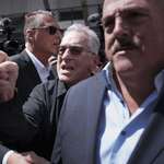 image for Robert De Niro, center, argues with a Donald Trump supporter
