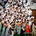 image for Student fans at a local HS basketball game yelling at an opposing player