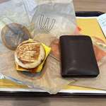 image for This is a 4$ sandwich at McDonalds. Wallet shown for size comparison.