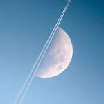 image for Boeing cutting across a sunlit moon