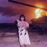 image for A photo of a young Bedouin Kuwaiti girl holding her lamb, during the Gulf War, (1991).