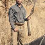 image for Donald Trump Jr. holding the tail of an elephant he just cut off
