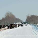 image for North Korean highway in 2010 being cleared of snow by manual labor