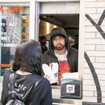 image for Eminem serving food to costumers at his Mom's Spaghetti restaurant