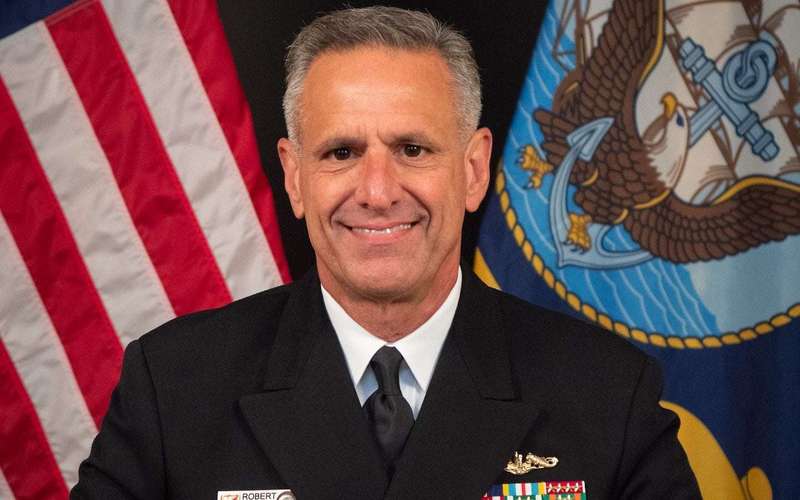 image for CEOs charged with top Navy admiral fight U.S. bribery allegations