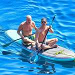 image for Matthew McConaughey & Woody Harrelson paddle boarding together in Croatia.