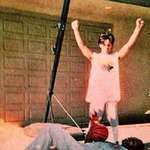 image for Prince stands victorious over Charlie Murphy during a game of basketball, 1985.