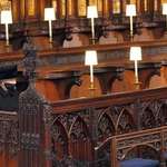 image for Queen sits alone at her husband's funeral.
