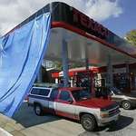 image for Gas station using a tarp to conceal customers using the pumps during the 2002 D.C. sniper shootings