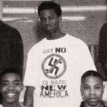 image for A young Kanye West in 94 wear a shirt written say no to Nazis
