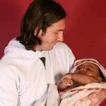 image for 20 year old Lionel Messi holding baby Lamine Yamal back in 2007. Yamal just scored for Spain tonight