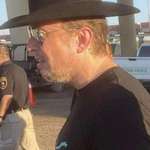 image for Elon Musk wearing a cowboy hat backwards