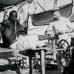 image for A British blacksmith removing the leg irons off a slave, 1907.