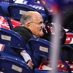 image for Rudy Giuliani after tripping up and falling into a set of folding chairs