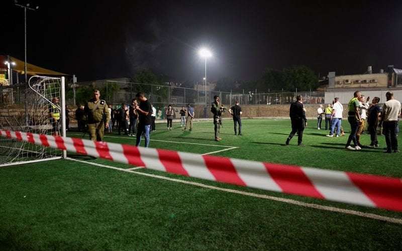 image for Israel says Hezbollah rocket kills 12 at football ground, vows response