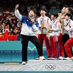 image for South Korean Olympian takes a selfie with North Korean athletes.