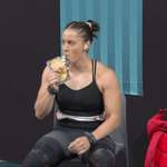 image for Canadian weightlifter Maude Charron drinking Canadian Maple Syrup before winning silver