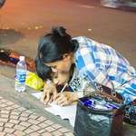 image for Poor Mother teaches her Son how to write letters (A street in Vietnam)