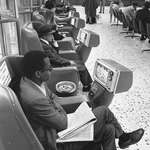 image for People watching coin-operated television sets at Greyhound Bus terminal in Los Angeles, 1969