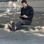 image for Keanu Reeves casually chilling, typing and smoking before his concert with Dogstar in Richmond, VA.