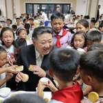 image for Kim Jong-un surrounded by children grasping for food (8-16-24)