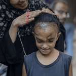 image for Let me fix her hair before you take her photo.