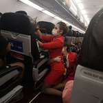 image for Picture off two cabin crew members who had to help a passenger in distress