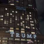 image for The DNC projects “Project 2025 HQ” onto Trump Tower in downtown Chicago on the eve of the convention