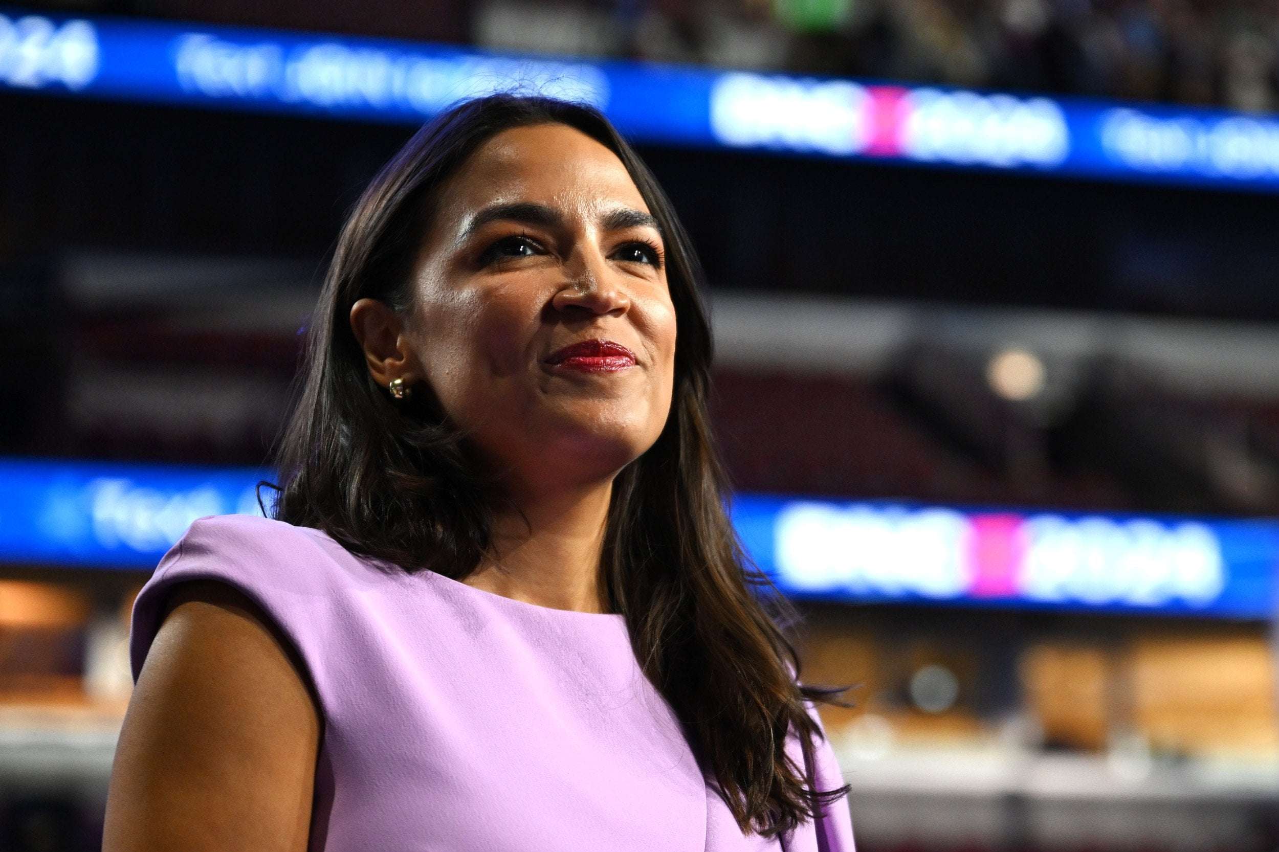 image for Donald Trump Would Sell US 'For a Dollar,' AOC Warns at the DNC