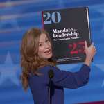 image for Mallory McMorrow holds up Project 2025 at the Democratic National Convention