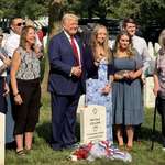 image for Trump posing for a photo op at the grave, seemingly joyful