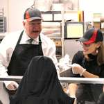 image for Tim Walz serving food at school cafeteria
