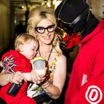 image for Sid Wilson from Slipknot, wife Kelly Osbourne, and their baby hanging out after a concert