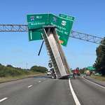image for 18-wheeler smashed through I-64 East signs.