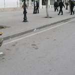 image for Man facing troops armed only with a baguette during Tunisian anti-regime protests in January 2011.