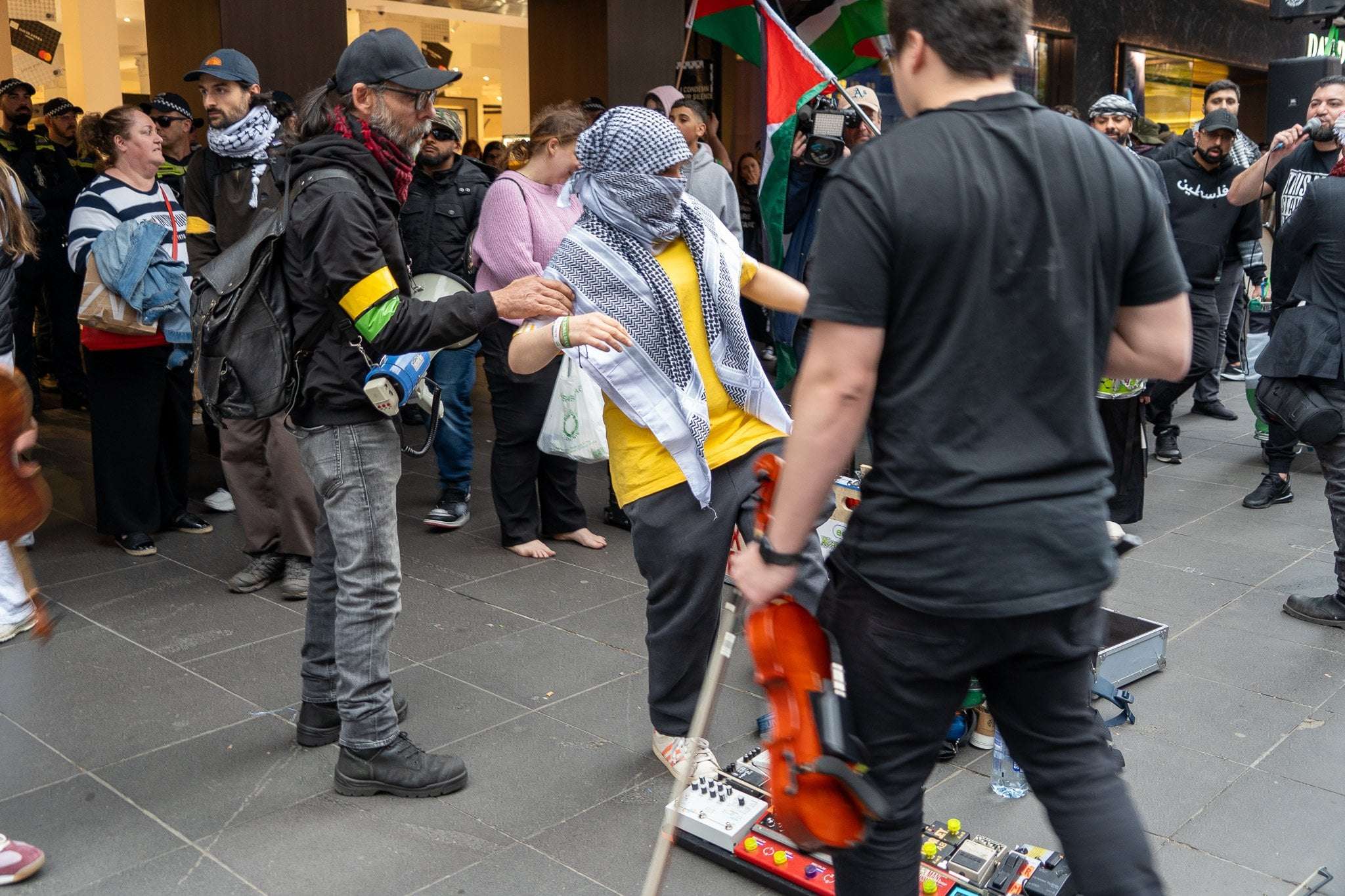 image for Busker attacked by pro-Palestinian protester as Melbourne faces biggest protest in decades