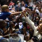 image for Vice President Kamala Harris high fives attendees at a campaign rally in Savannah