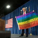 image for Donald Trump holding a Pride flag (2019) before stripping employment equality rights in 2020.